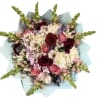 Bouquet of pink and burgundy roses with white daisies and purple accents