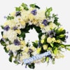 Circular floral wreath with white and pale yellow flowers and purple accents