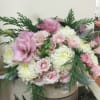 Beautiful blooms of pinks and whites with green accents in a gold
