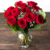 Red roses in a vase with baby's breath and green fillers.

Standard-12 roses
Deluxe-24