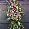Includes soothing flowers such as white roses carnations cushion poms gladiolus and