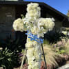 This elegant 36-inch cross floral
arrangement is a heartfelt tribute to honor a