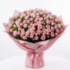 Soft blush spray roses wrapped in elegant pink paper.