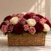 Mixed roses in a woven basket arrangement