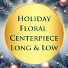 Holiday floral centerpiece sign with pine branches and ornaments