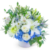 White lilies and roses with blue hydrangeas in a white vase
