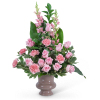 Pink roses and carnations in a ceramic vase
