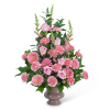 Pink roses, carnations, and gerbera daisies in a vase