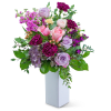 Mixed pink and lavender bouquet in a white vase