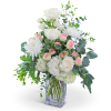 White roses and chrysanthemums in a clear glass vase