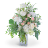 White roses and pink spray roses in a clear glass vase