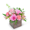 Pink and white floral arrangement in a rustic wooden box
