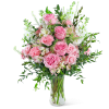 Pink roses and carnations in a clear glass vase