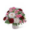 Pink and red carnations with white chrysanthemums in a white vase