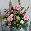 Pink and white mixed flower arrangement in a vase