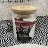 Scented candle in a glass jar with a bamboo lid
