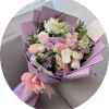 Lavender-toned blooms mingle with soft pink and creamy white roses in a