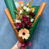Handheld bouquet with peach gerbera, white roses, and magenta alstroemeria