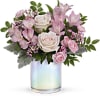 A bouquet of pink roses, alstromeria, waxflower &amp; carnations opulently arranged in