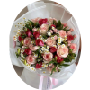 Bouquet of pink and red roses with small white daisies wrapped in white paper