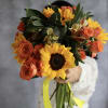 Bouquet of yellow sunflowers and orange roses tied with a yellow ribbon