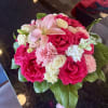 Pink and white rose bouquet with a pale lily and carnations