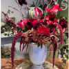 Rustic ceramic vase with mix of red Anthurium, Cymbidium orchid,Peonies, Red roses....