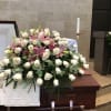 Beautiful Casket Spray made with Roses, Lilies, and accompanied by greenery.

If you