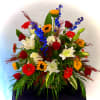 Colorful mixed flower arrangement with roses, lilies, and gerbera daisies