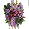 Standing floral spray with pink roses and purple flowers