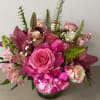 Pink rose and hydrangea bouquet in a glass vase