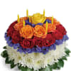 Round bouquet of red and orange roses with white chrysanthemums and yellow candles