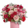 Pink and red rose bouquet in a pink vase