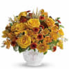 Yellow roses and autumn flowers arranged in a white vase