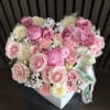 A luxurious heart-shaped flower arrangement designed in soft blush pink and creamy