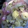 A refined and elegant bouquet featuring soft ivory and blush blooms arranged