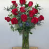 Red Roses , Thistles in 12" glass vase