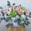 Mixed color Roses , Hydrangeas in white ceramic container
