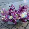Orchid blooms, Hydrangeas, Roses inn ceramic container 