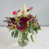 She is petite and pretty with a mix of berry toned blooms!