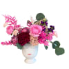 Cutest vase filled with fun and funky colorful blooms