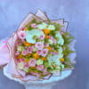 Large bouquet of pink and white roses with pale orchids and yellow accents