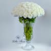 White rose bouquet in a clear glass vase
