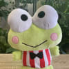 Plush frog toy with a red-and-white striped outfit and bow tie