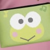 Green frog-face pouch on a pink background