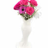 Pink roses and a purple daisy in a white vase