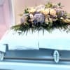 The Casket Spray is a lush,elegant, and stylized casket arrangement. Customer can