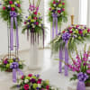 Two standing sprays, a basket floor arrangement, a lush and garden design