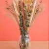 A breezy bundle vase of naturally dried botanicals gives a minimalist, rustic