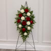 Alternating bands of red and white roses create a dignified, classic sympathy